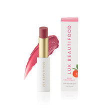 Load image into Gallery viewer, Lük Beautifood lip balm with pink shade and packaging on a white background