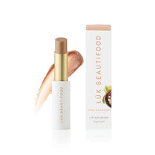 Load image into Gallery viewer, Lük Beautifood lip nourish stick with packaging on a white background