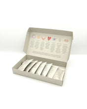 Load image into Gallery viewer, Box of shower spell sachets with a white background