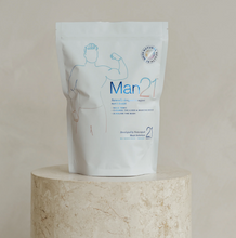 Load image into Gallery viewer, Man21 product packaging on a beige pedestal with a neutral background