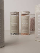 Load image into Gallery viewer, Collection of 'Kind Bod' product containers on a light surface with a neutral background