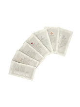 Load image into Gallery viewer, Set ofKind Bod skincare product packets arranged in a semi-circle on a white background
