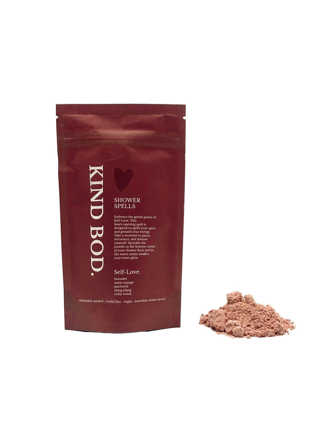 Red packaging of KIND BOD with a small pile of brown powder on a white background