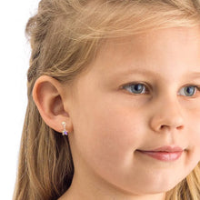 Load image into Gallery viewer, Young girl with clear skin wearing a small purple flower stud earring, close-up face view
