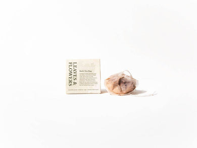 Tea bag and packaging labeled 'Leaves & Flowers' on a white background